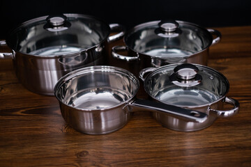 set of pots on wooden background