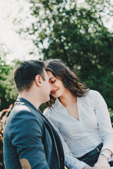 Couple in love. Valentines day celebration, love and dating outdoor concept. Happy loving couple walking on the city street, hugging and kissing