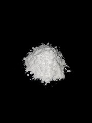 Cocaine drug powder on black background