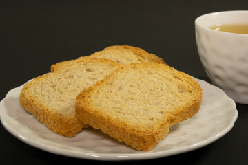 Cup of coffee and Bauducco toastes