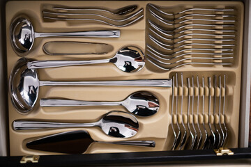 Set of cutlery in a wooden case. Close up