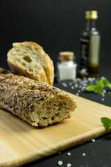 Rustic bread in a dark and wooden backgound 