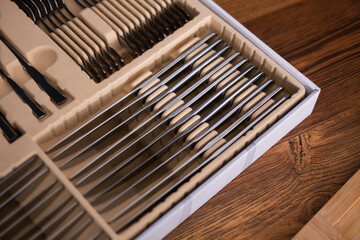 Set of cutlery in a wooden case. Close up