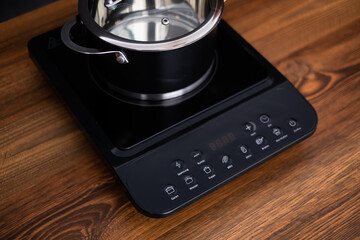 Close up view of an electrical kitchen induction ceramic hob.