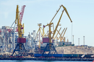 Lifting harbor cranes, shipping containers and granaries in the cargo seaport
