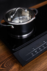 Close up view of an electrical kitchen induction ceramic hob.