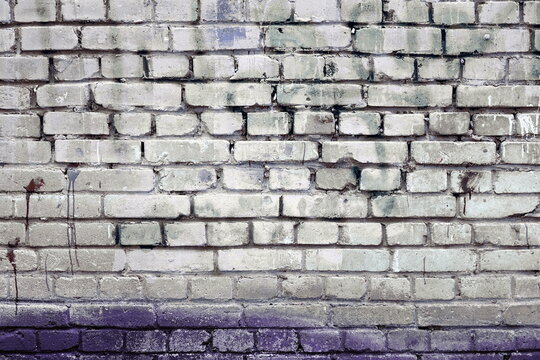 Grungy Purple Urban Wall Background. Empty Grunge Texture Surface. Graffiti Covered With White Paint. Dirty Violet And White Brickwall Design Banner.