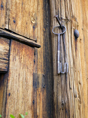Old Wooden door with a metal key