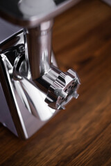 household electric meat grinder on a light gray background, different perspective positions. kitchen appliances