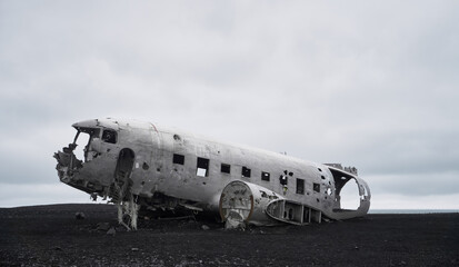 Wreckage of a crashed plane on Vik's black sand beaches