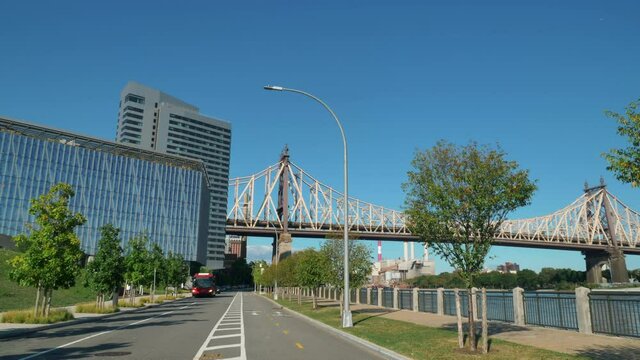 Medium, Red Bus Passes The Cornell Tech Campus On A Sunny Day, New York, USA