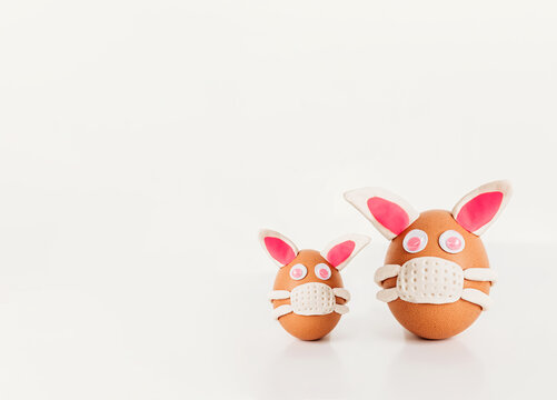 Easter eggs bunnies wearing masks.