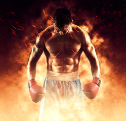 Boxer in red gloves on fire background