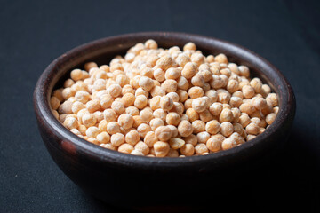 raw chickpeas in clay dish