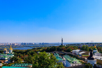 Fototapeta na wymiar View of Kiev Pechersk Lavra (Kiev Monastery of the Caves), Motherland Monument and the Dnieper river in Ukraine. View from Great Lavra Bell Tower