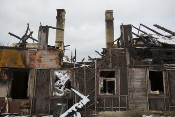 Burnt wooden house. House after the fire. House destroyed in a gas explosion .