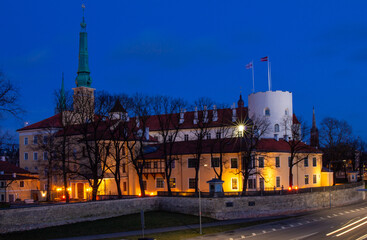 Obraz premium Cityscape to Riga castle is located on the banks of river Daugava, Old Town. Rigas pils official residence of president and Museum of History with illumination on night. RIGA Capital of Latvia.