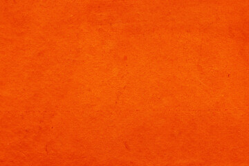 Cardboard red abstract pattern texture close-up. Retro old paper background. Grunge concrete wall. Vintage blank wallpaper.