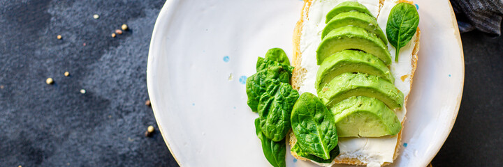 avocado sandwich delicious vegetarian or vegan breakfast portion on the table for healthy meal snack outdoor top view copy space for text food background rustic image