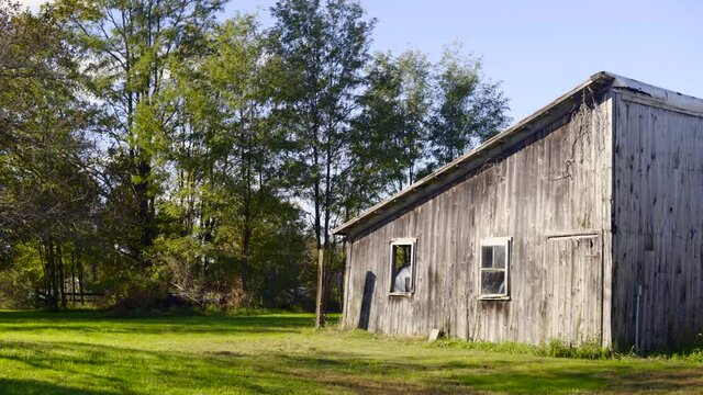 Vintage Rustic Barn Farm House Exterior on a Sunny Day