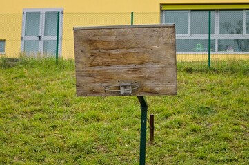 A basketball hoop without a net with a wooden backboard (Pesaro, Italy, Europe)