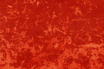 Cardboard red abstract pattern texture close-up. Retro old paper background. Grunge concrete wall. Vintage blank wallpaper.