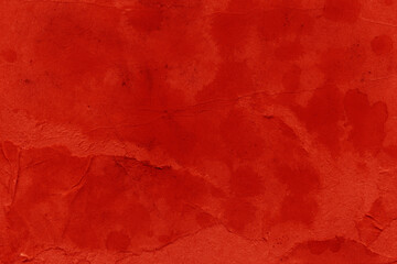 Cardboard red abstract pattern texture close-up. Retro old paper background. Grunge concrete wall. Vintage blank wallpaper.