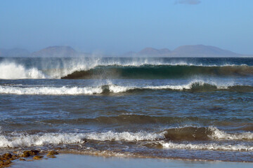 waves breaking on the beach