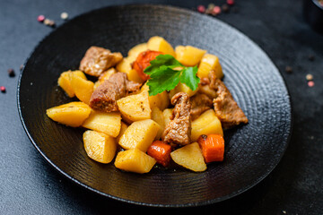 stewed potatoes and meat roast vegetables goulash portion on the table for healthy meal snack outdoor top view copy space for text food background rustic image