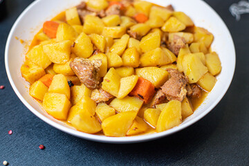 stewed potatoes and meat roast vegetables goulash portion on the table for healthy meal snack outdoor top view copy space for text food background rustic image
