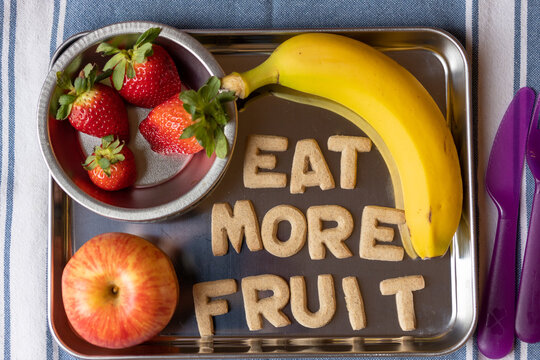 Fruit Snack Tray with Strawberries, Apples, Bananas with Cookies spelling "Eat More Fruit"