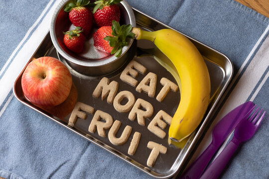 Fruit Snack Tray with Strawberries, Apples, Bananas with Cookies spelling "Eat More Fruit"