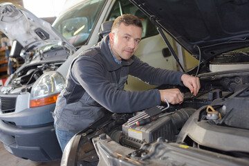 Fototapeta na wymiar hands of mechanic working in auto repair shop