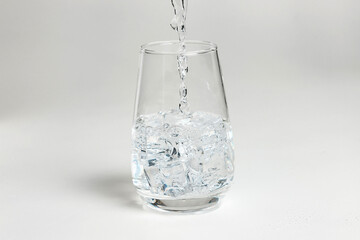 Glass of mineral carbonated water with ice