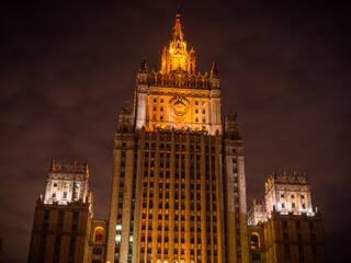 Fototapeta na wymiar Illuminated building of the Russian Ministry of Foreign Affairs against the background of the night sky, bottom view