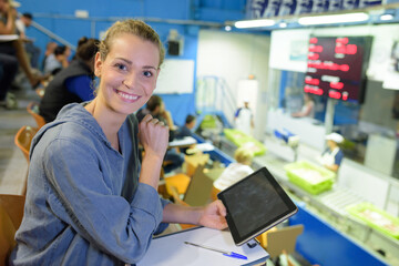 portrait of a happy woman holding tablet