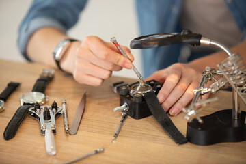 pocket watch being repaired by senior watch maker close-up - obrazy, fototapety, plakaty