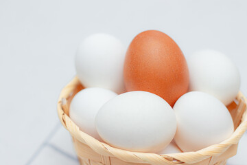 chicken eggs on a checked kitchen towel on a light table. concept of farm products and natural food. Article about home products. Fresh chicken eggs .