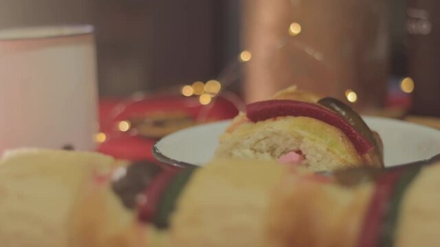 Rosca de reyes, traditional day in Mexico, feast day of the holy kings, rosca de reyes with doll, in red background.