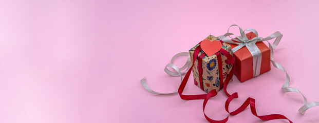 Two gift boxes. A gift on a pink background. 