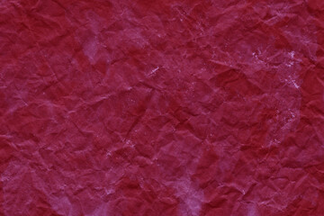 Fototapeta premium Cardboard red abstract pattern texture close-up. Retro old paper background. Grunge concrete wall. Vintage blank wallpaper.