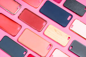 Pile of multicolored plastic back covers for mobile phone. Choice of smart phone protector...