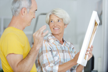 a senior couple with tools