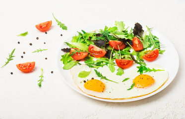 Breakfast  - fried eggs  and fresh vegetables. Top view