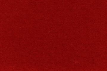 Cardboard red abstract pattern texture close-up. Retro old paper background. Grunge concrete wall. Vintage blank wallpaper.