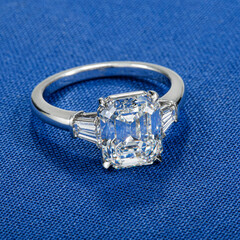 Diamond engagement ring on blue