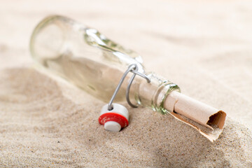  letter in a glass bottle on sea sand. Message written and sent in the distant past. A valuable...