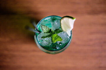 Summer drinks with ice, fresh berries, lemon and berries