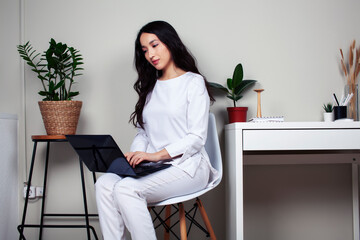 young pretty asian woman in white form working in clinic with laptop, lifestyle working people concept