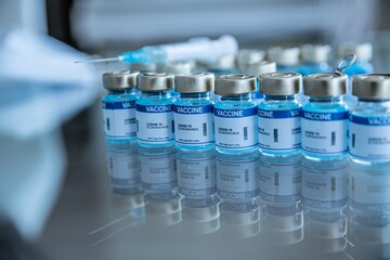 Ampoules with covid-19 vaccine and syringe injection. Coronavirus COVID-19 vaccine in ampoules.